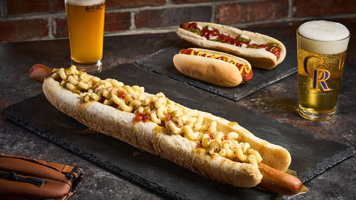 MLB stadiums unveil extravagant new food options like $180 burgers and crab nachos.