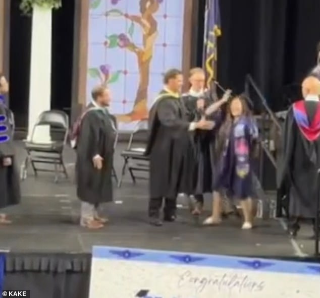 Kansas High School Administrators Force Diplomas With Aggressive Handshakes